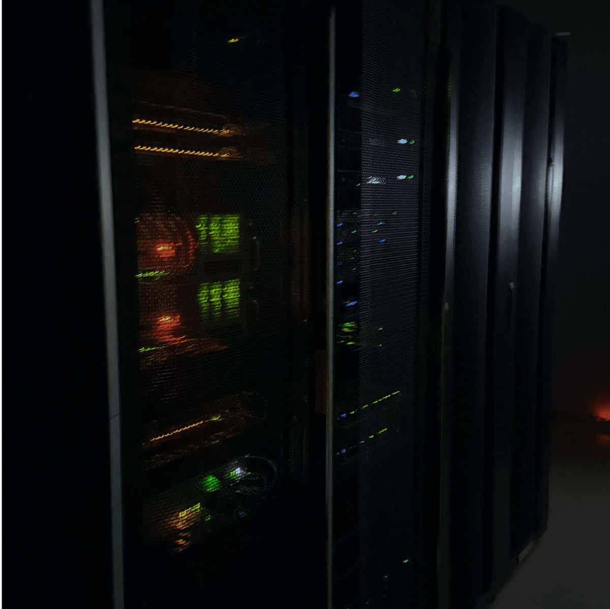 Modern data center server room with advanced rack-mounted equipment, organized cable management, and LED indicators showing operational status